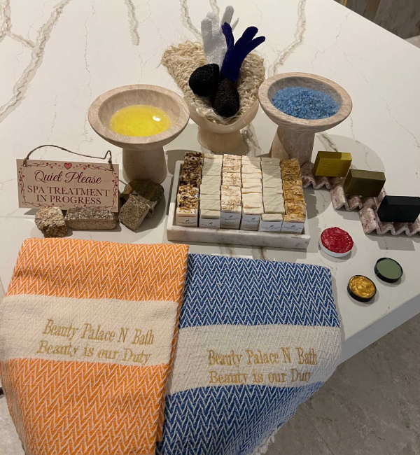 Assortment of soaps, oils, and towels for a Moroccan bath